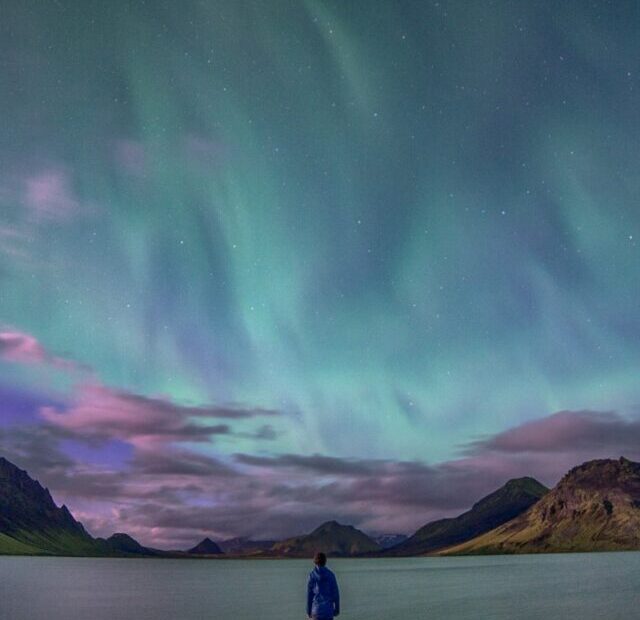 person standing front of body of water